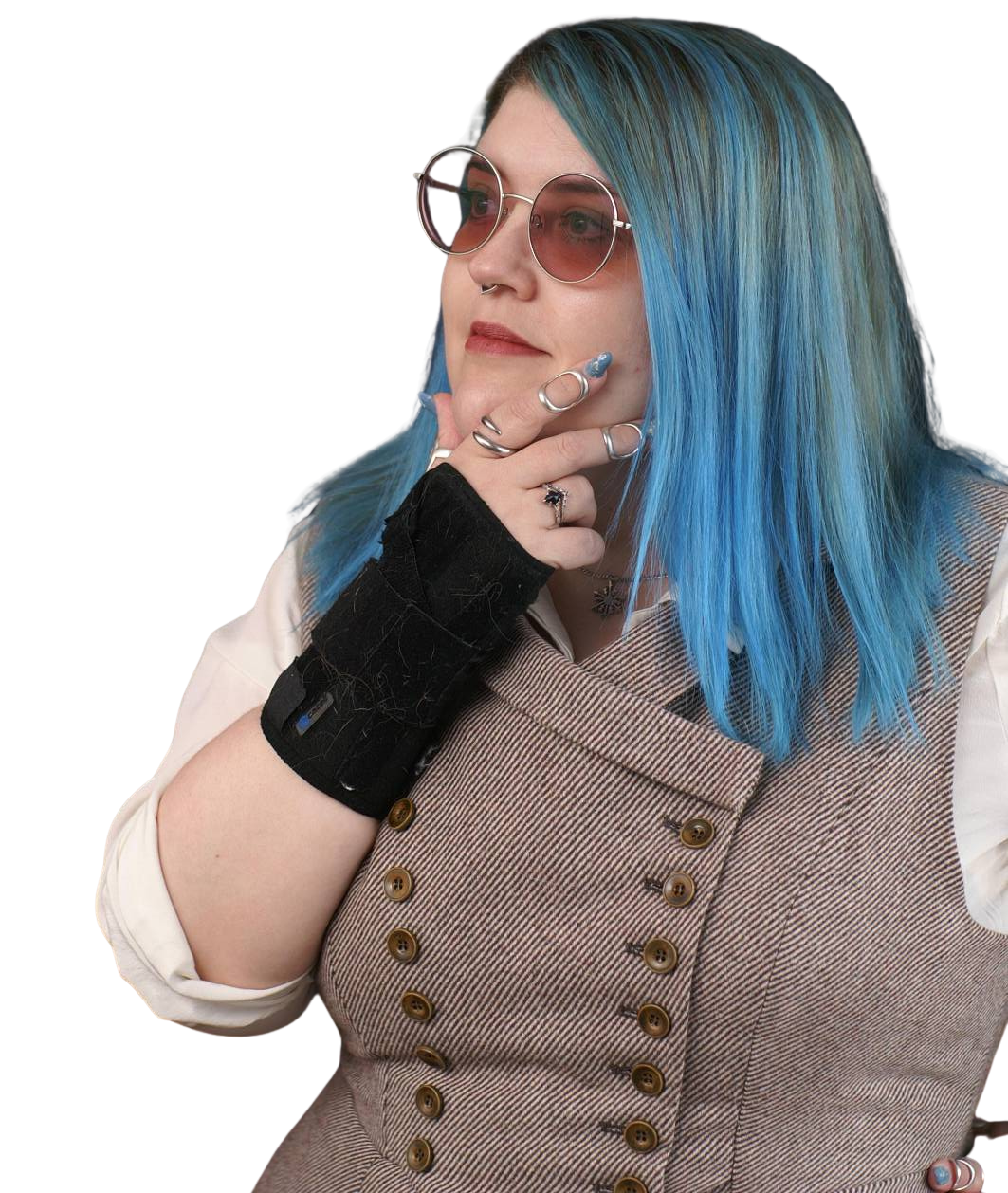 A woman in a wool dress with blue hair and purple glasses in a thoughtful stance